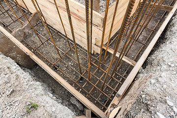 Image showing Strengthening the corner of the strip foundation during the construction of the house