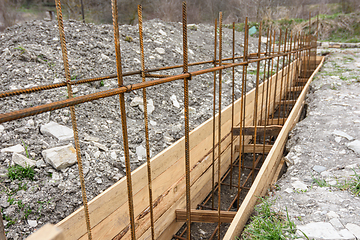 Image showing Reinforcement of the strip foundation with metal reinforcement, the top row of reinforcement is in focus