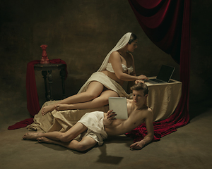 Image showing Modern remake of classical artwork with modern tech theme - young medieval couple on dark background