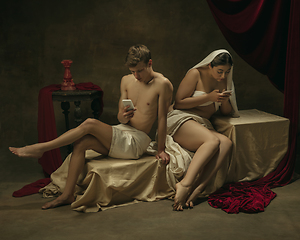 Image showing Modern remake of classical artwork with modern tech theme - young medieval couple on dark background