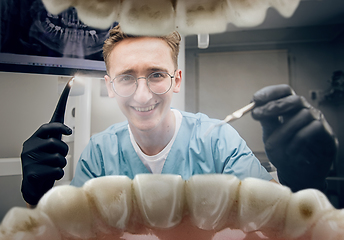 Image showing Doctor looking into the mouth, checking, examining teeth