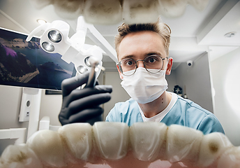 Image showing Doctor looking into the mouth, checking, examining teeth