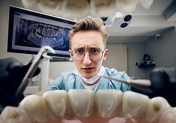 Image showing Doctor looking into the mouth, checking, examining teeth