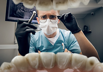 Image showing Doctor looking into the mouth, checking, examining teeth