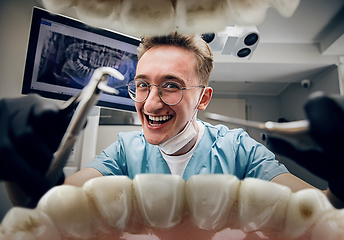 Image showing Doctor looking into the mouth, checking, examining teeth