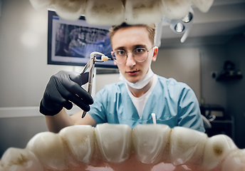 Image showing Doctor looking into the mouth, checking, examining teeth