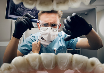 Image showing Doctor looking into the mouth, checking, examining teeth