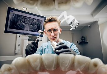 Image showing Doctor looking into the mouth, checking, examining teeth