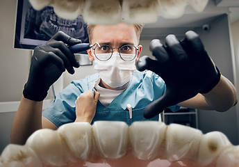 Image showing Doctor looking into the mouth, checking, examining teeth