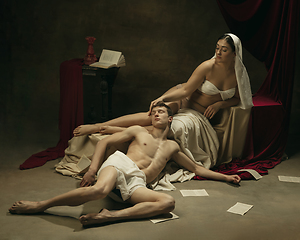 Image showing Modern remake of classical artwork - young medieval couple on dark background, comparison of eras concept