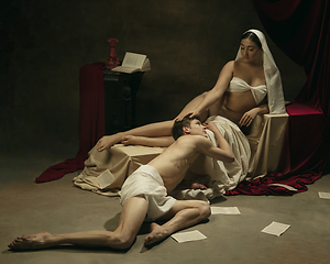 Image showing Modern remake of classical artwork - young medieval couple on dark background, comparison of eras concept