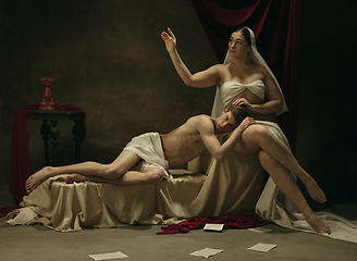 Image showing Modern remake of classical artwork - young medieval couple on dark background, comparison of eras concept