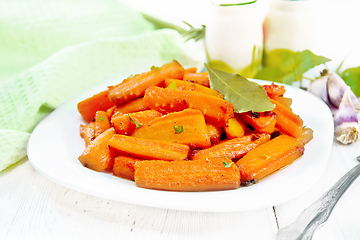 Image showing Carrots fried in plate on light board