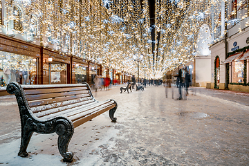 Image showing Christmas market stalls and Christmas street light decoration.