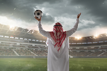 Image showing Arabian businessman back view standing on his stadium during sport match