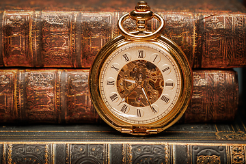 Image showing Old Books and Vintage pocket watch