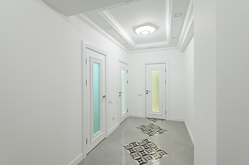 Image showing interior of white hallway with doors