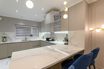 Image showing Luxury white modern marble kitchen in studio space