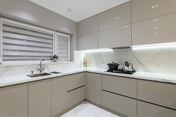 Image showing Luxury white modern marble kitchen in studio space