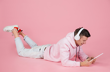 Image showing Caucasian man\'s portrait isolated on pink studio background with copyspace