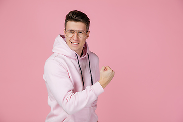 Image showing Caucasian man\'s portrait isolated on pink studio background with copyspace