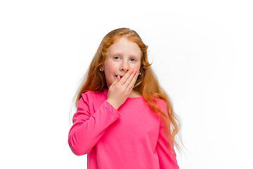 Image showing Happy redhair girl isolated on white studio background. Looks happy, cheerful, sincere. Copyspace. Childhood, education, emotions concept