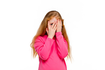 Image showing Happy redhair girl isolated on white studio background. Looks happy, cheerful, sincere. Copyspace. Childhood, education, emotions concept