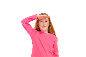 Image showing Happy redhair girl isolated on white studio background. Looks happy, cheerful, sincere. Copyspace. Childhood, education, emotions concept