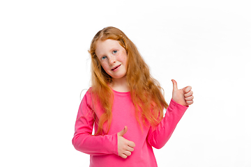 Image showing Happy redhair girl isolated on white studio background. Looks happy, cheerful, sincere. Copyspace. Childhood, education, emotions concept