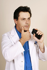 Image showing Doctor recording patient information