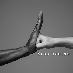 Image showing African and caucasian hands gesturing on gray studio background, tolerance and equality concept