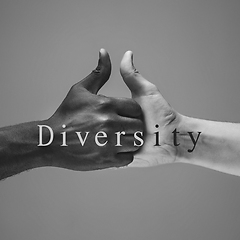 Image showing African and caucasian hands gesturing on gray studio background, tolerance and equality concept