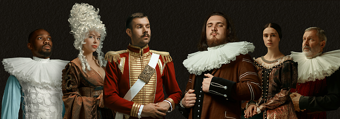 Image showing Medieval people as a royalty persons in vintage clothing on dark background. Concept of comparison of eras, modernity and renaissance, baroque style.