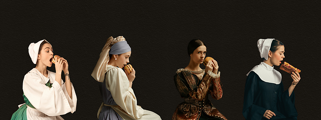 Image showing Medieval women as a persons from famous artworks in vintage clothing on dark background. Concept of comparison of eras, modernity and renaissance, baroque style.