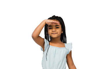 Image showing Happy longhair brunette little girl isolated on white studio background. Looks happy, cheerful, sincere. Copyspace. Childhood, education, emotions concept