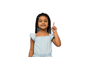 Image showing Happy longhair brunette little girl isolated on white studio background. Looks happy, cheerful, sincere. Copyspace. Childhood, education, emotions concept