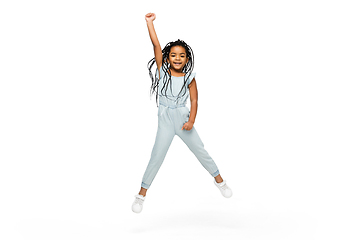 Image showing Happy longhair brunette little girl isolated on white studio background. Looks happy, cheerful, sincere. Copyspace. Childhood, education, emotions concept