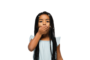 Image showing Happy longhair brunette little girl isolated on white studio background. Looks happy, cheerful, sincere. Copyspace. Childhood, education, emotions concept