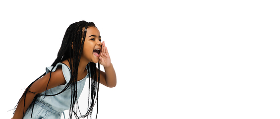 Image showing Happy longhair brunette little girl isolated on white studio background. Looks happy, cheerful, sincere. Copyspace. Childhood, education, emotions concept