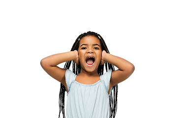 Image showing Happy longhair brunette little girl isolated on white studio background. Looks happy, cheerful, sincere. Copyspace. Childhood, education, emotions concept