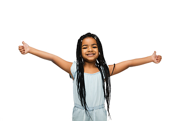 Image showing Happy longhair brunette little girl isolated on white studio background. Looks happy, cheerful, sincere. Copyspace. Childhood, education, emotions concept