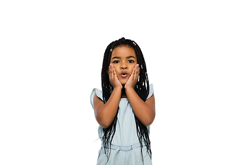 Image showing Happy longhair brunette little girl isolated on white studio background. Looks happy, cheerful, sincere. Copyspace. Childhood, education, emotions concept