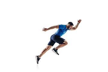 Image showing Caucasian professional male runner, athlete training isolated on white studio background. Copyspace for ad.