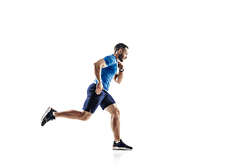 Image showing Caucasian professional male runner, athlete training isolated on white studio background. Copyspace for ad.