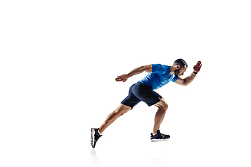 Image showing Caucasian professional male runner, athlete training isolated on white studio background. Copyspace for ad.