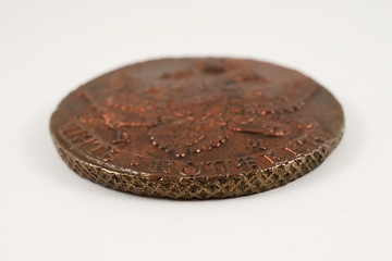 Image showing edge of an old Russian copper coin of the 18th century on white 