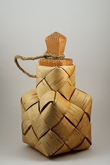 Image showing a traditional salt container woven from birch bark with a wooden