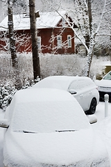 Image showing snow covered cars of people who came to celebrate christmas