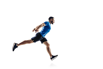 Image showing Caucasian professional male runner, athlete training isolated on white studio background. Copyspace for ad.