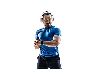 Image showing Caucasian professional male runner, athlete training isolated on white studio background. Copyspace for ad.